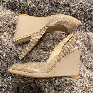 Used Calvin Klein snake print platform shoes. Size 8.
